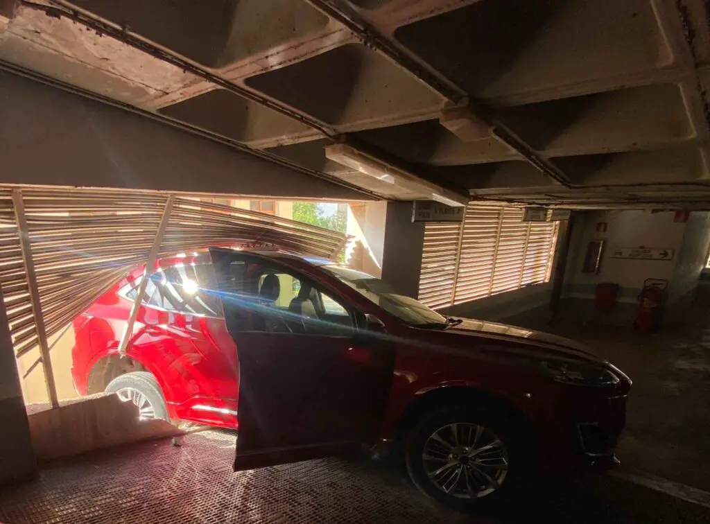 Car Hangs Perilously Over Parking Lot Edge in Ibiza