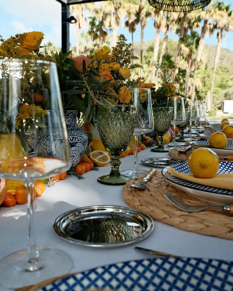 The celebration featured tables adorned with yellow flowers and citrus fruits like lemons, grapefruits, and kumquats.